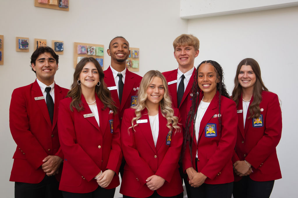 Members of SkillsUSA Ohio wearing red blazers and smiling